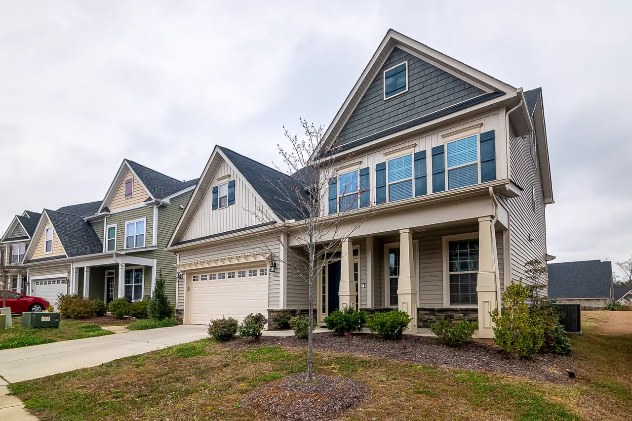 A row of two-story houses on a suburban street.